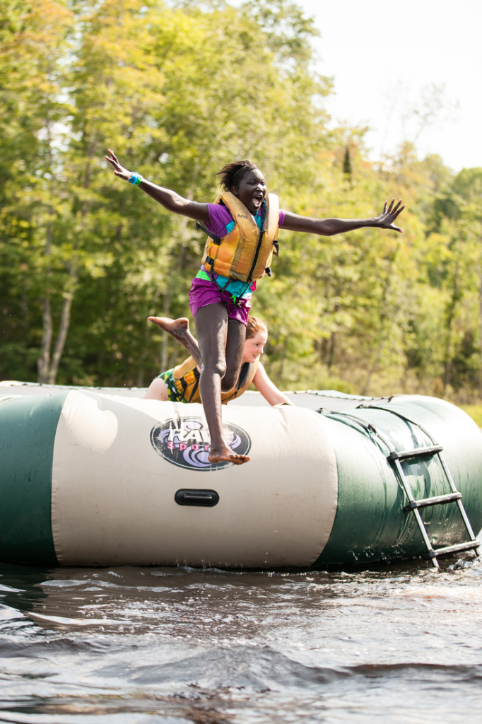 Girl Jumping off Water Trampoline